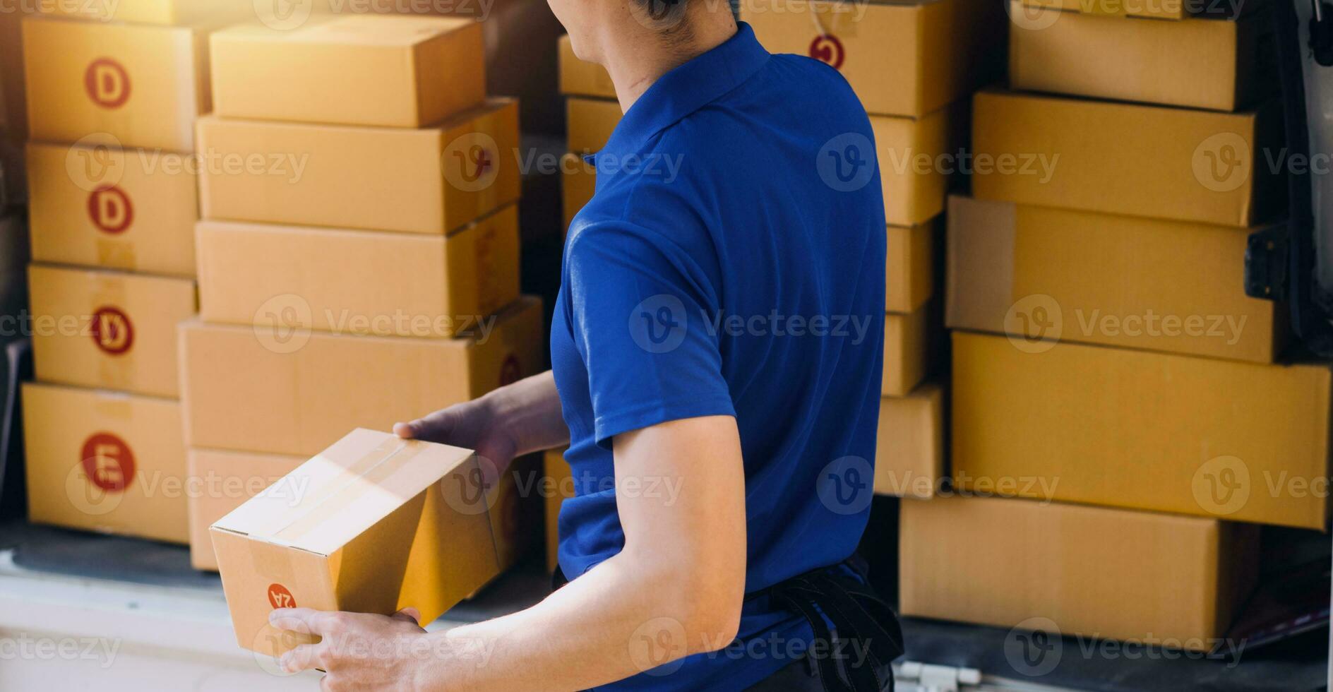 Starting small businesses SME owners man entrepreneurs working, box and check online orders to prepare to pack the boxes, sell to customers, sme business ideas online. photo