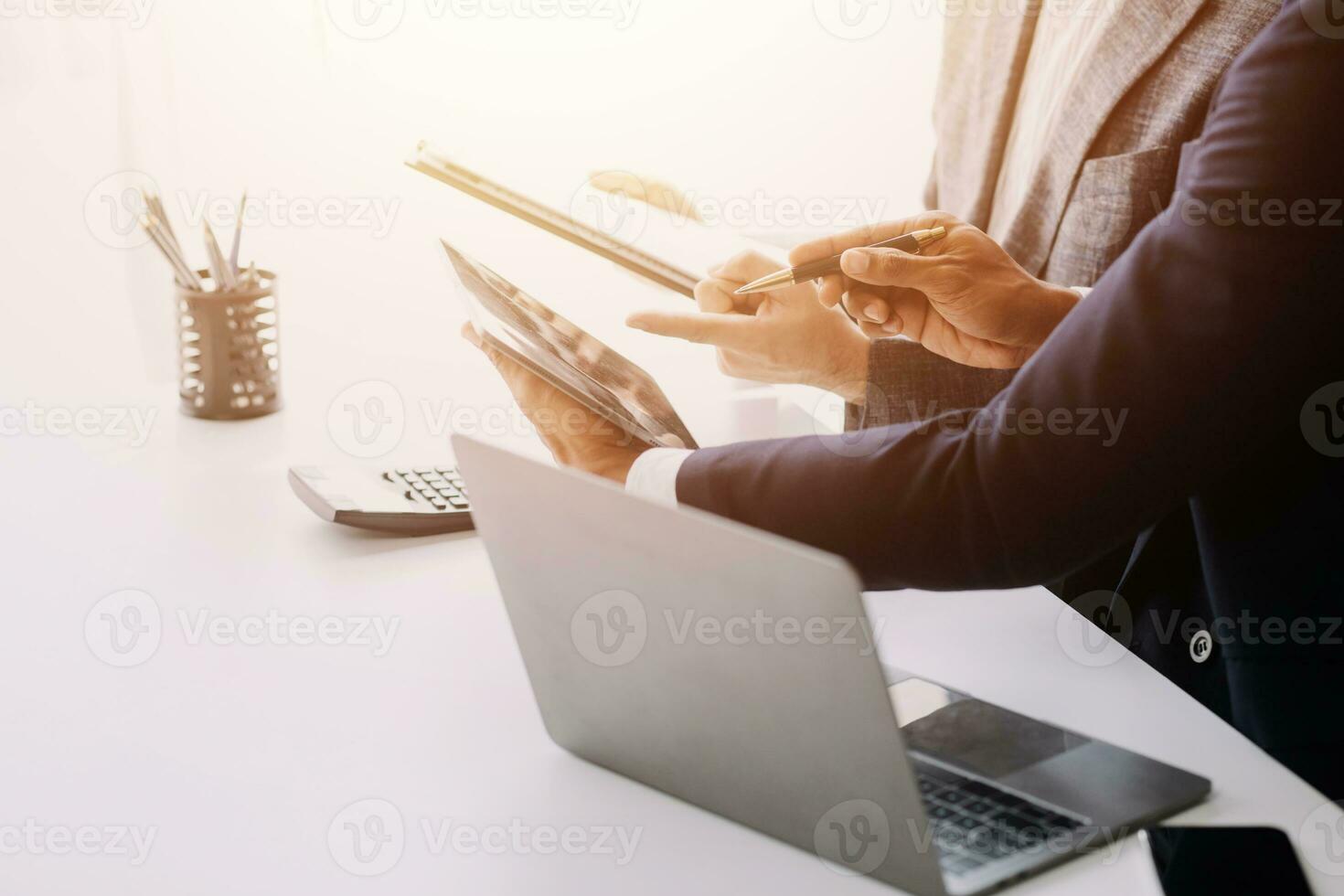 Audit concept,Administrator business man financial inspector and secretary making report calculating balance. Internal Revenue Service checking document. photo