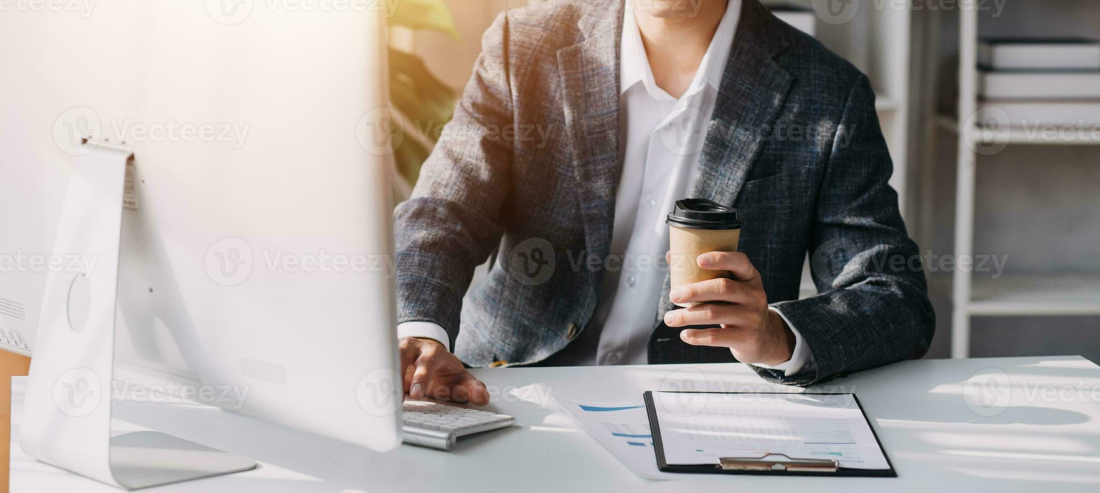 Audit concept,Administrator business man financial inspector and secretary making report calculating balance. Internal Revenue Service checking document. photo