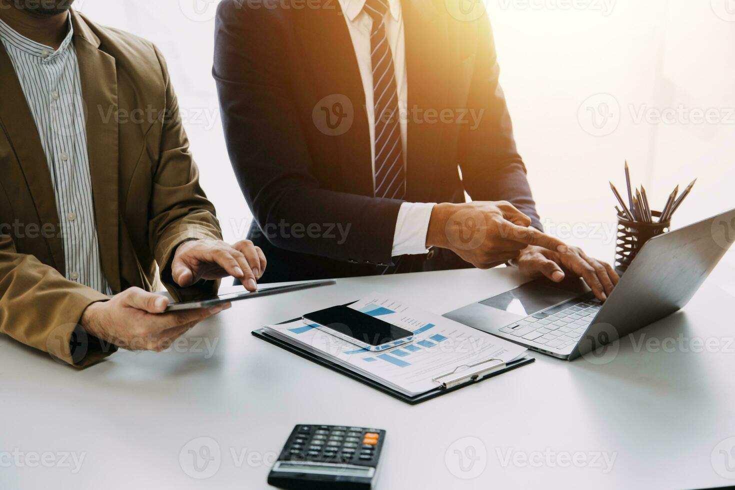 Audit concept,Administrator business man financial inspector and secretary making report calculating balance. Internal Revenue Service checking document. photo