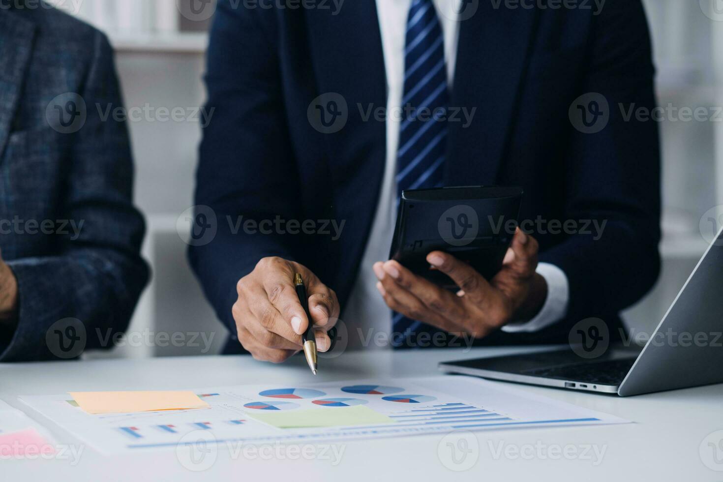 Audit concept,Administrator business man financial inspector and secretary making report calculating balance. Internal Revenue Service checking document. photo