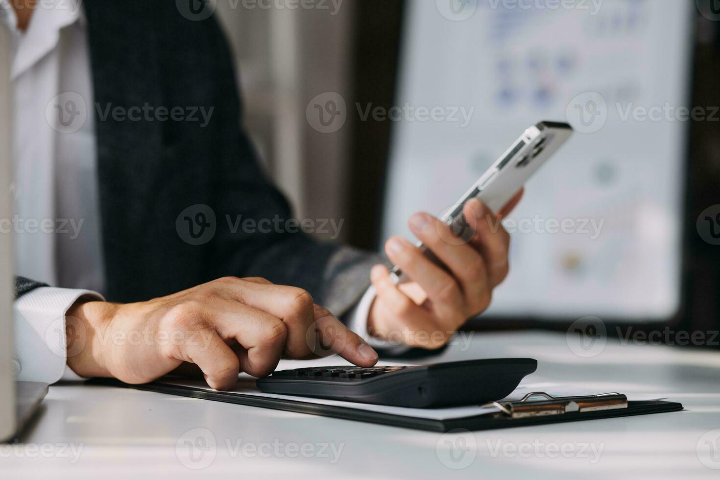 Audit concept,Administrator business man financial inspector and secretary making report calculating balance. Internal Revenue Service checking document. photo