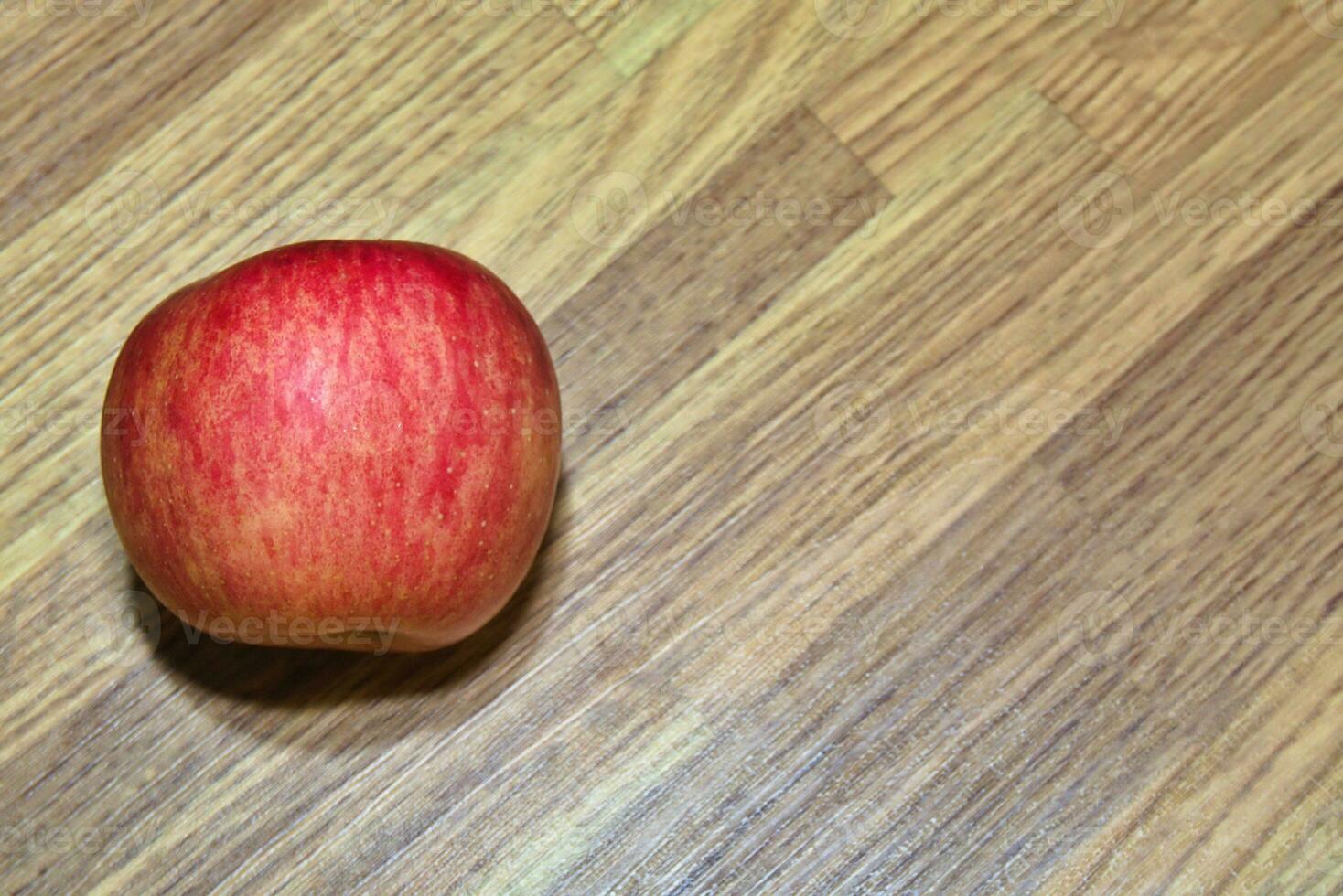 red apples, fresh fruit just picked from the tree on the table photo