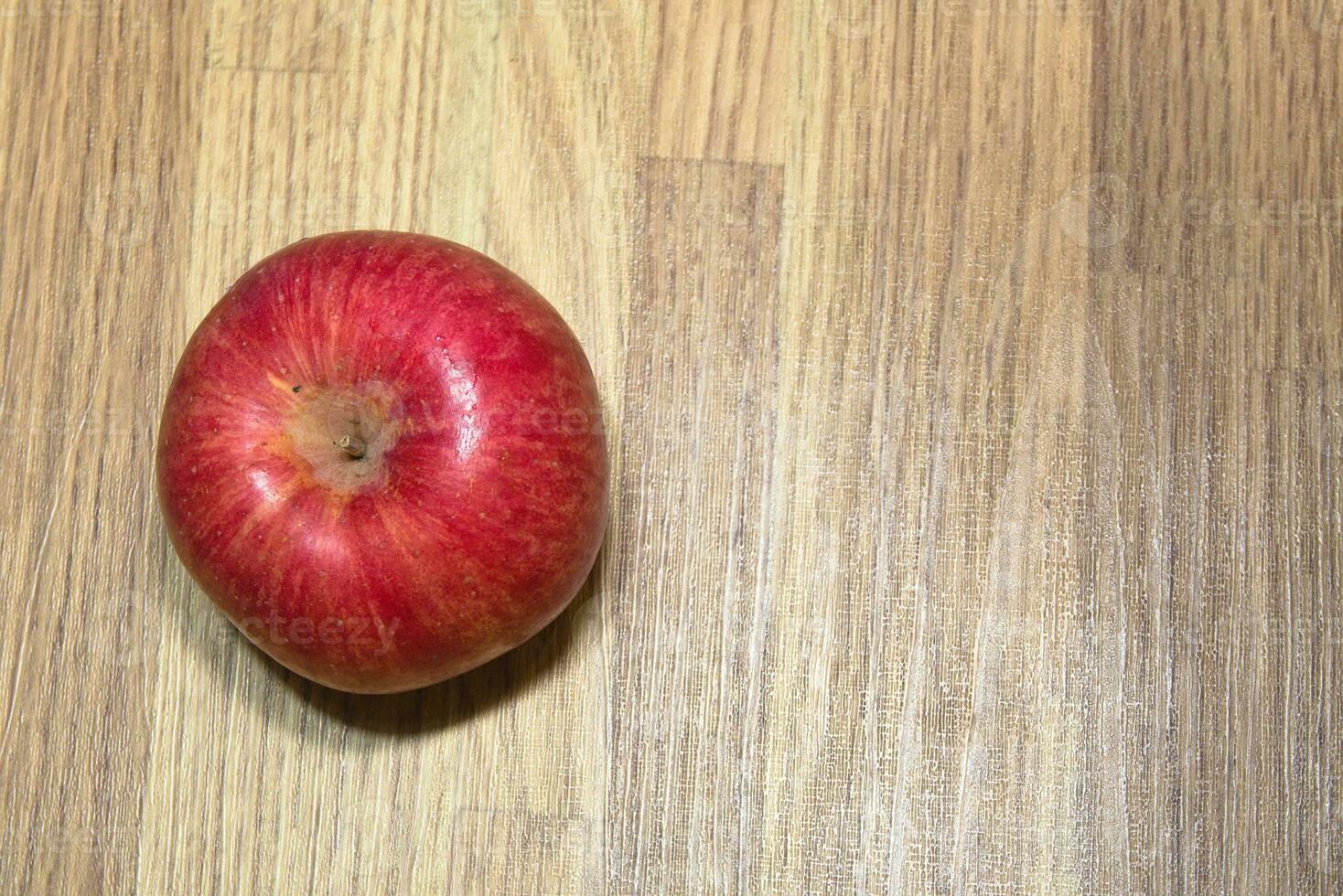 red apples, fresh fruit just picked from the tree on the table photo