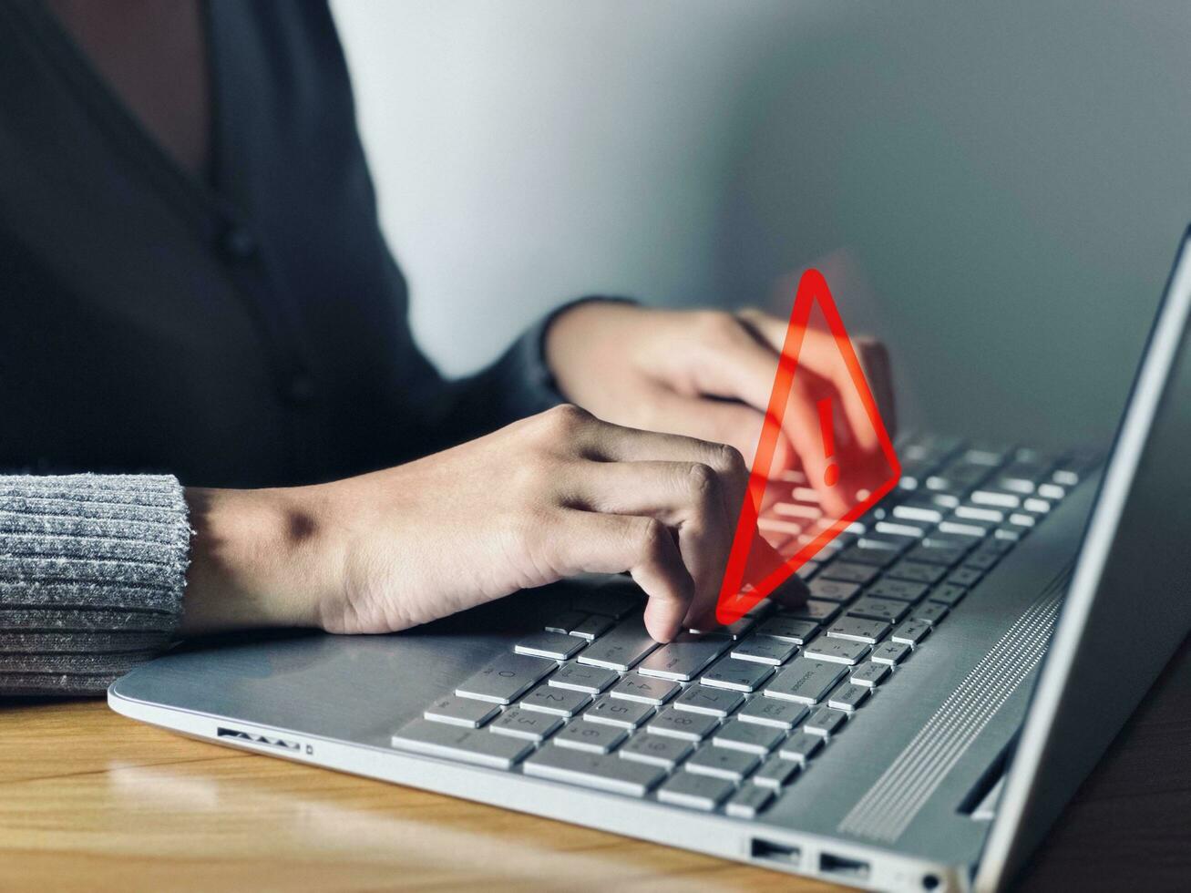 Businessman working on computer. Concept of warning system, hacking on computer network, crime and virus, malicious software. photo