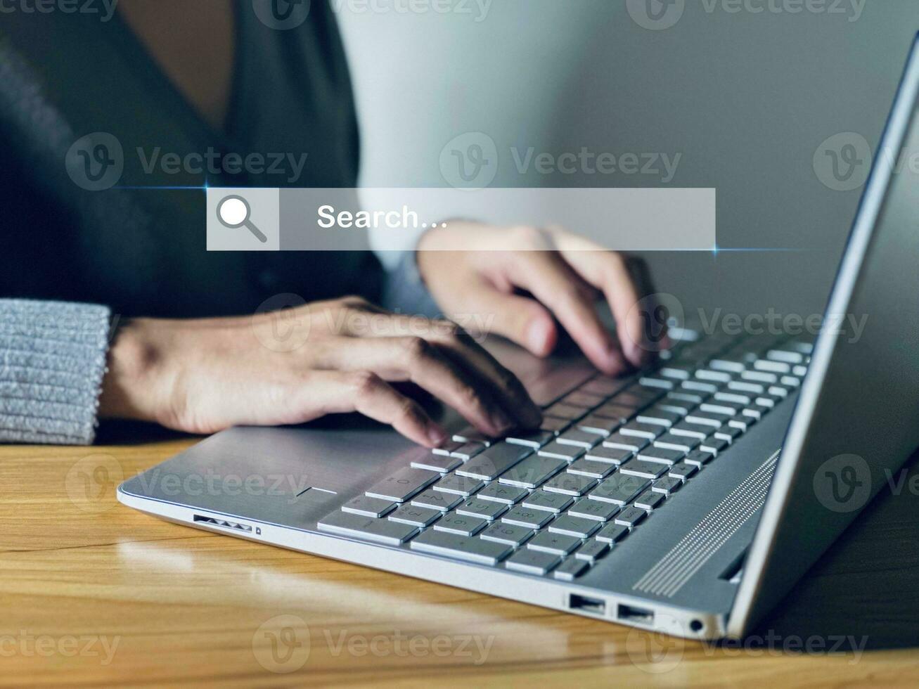 Business woman using laptop to search internet surfing information network concept. photo