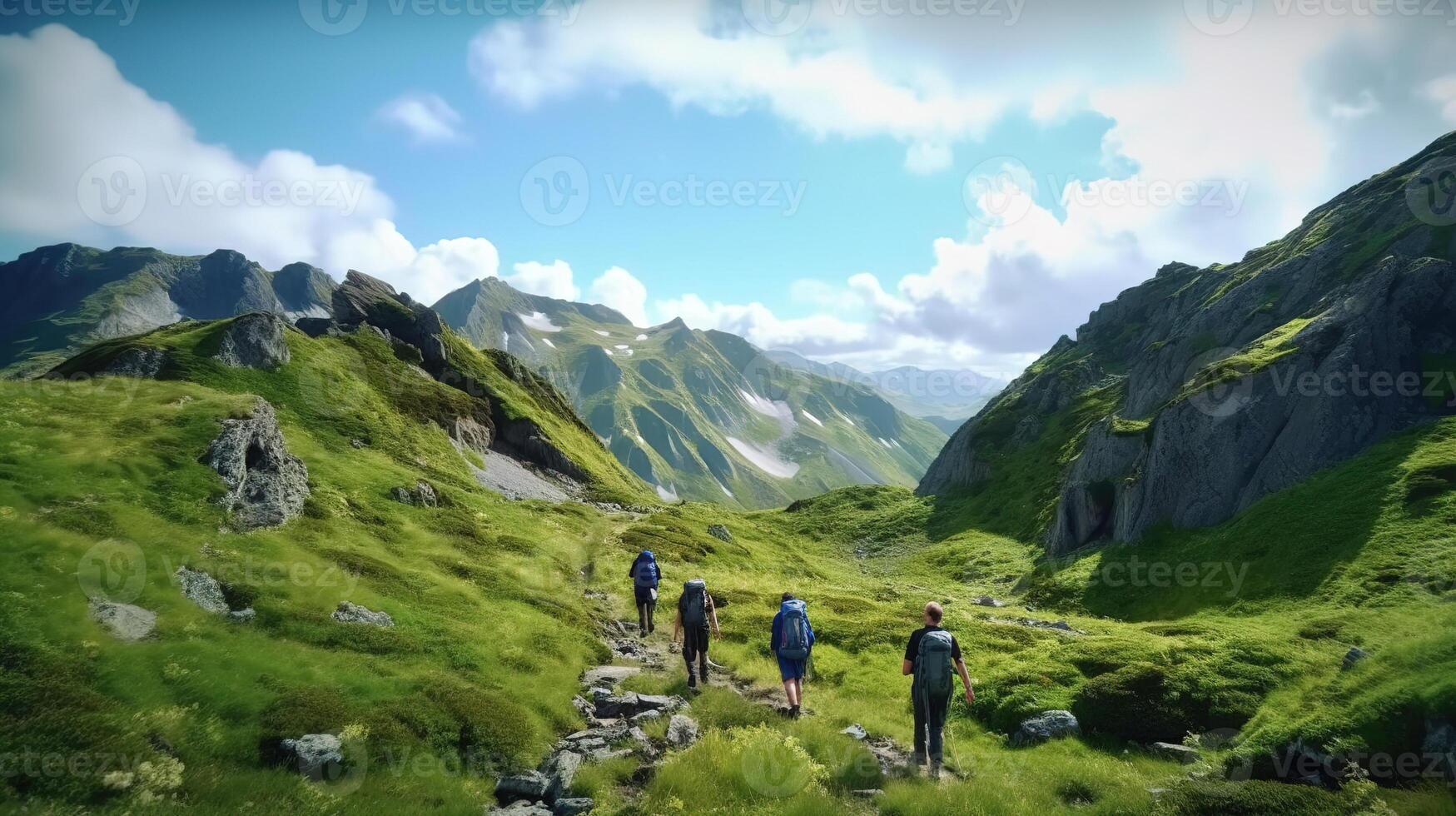 Group of hikers walks in green mountains with blue sky . photo