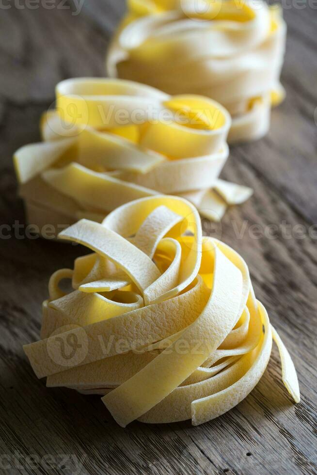 Raw fettuccine pasta photo