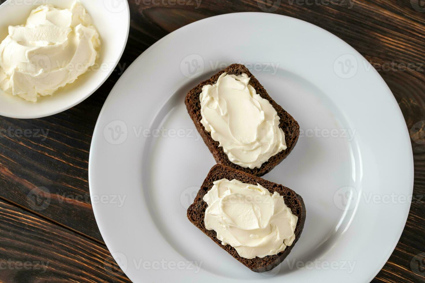 Slices of rye bread with cream cheese photo