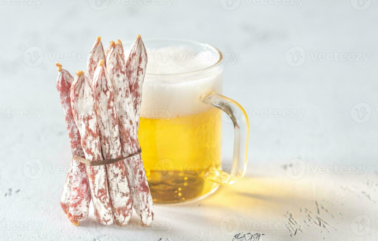 Snack fuet sausages with beer photo