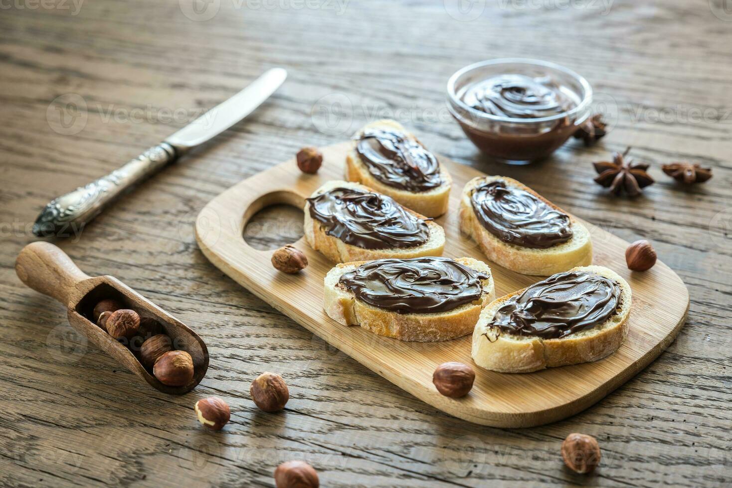 Slices of baguette with chocolate cream photo