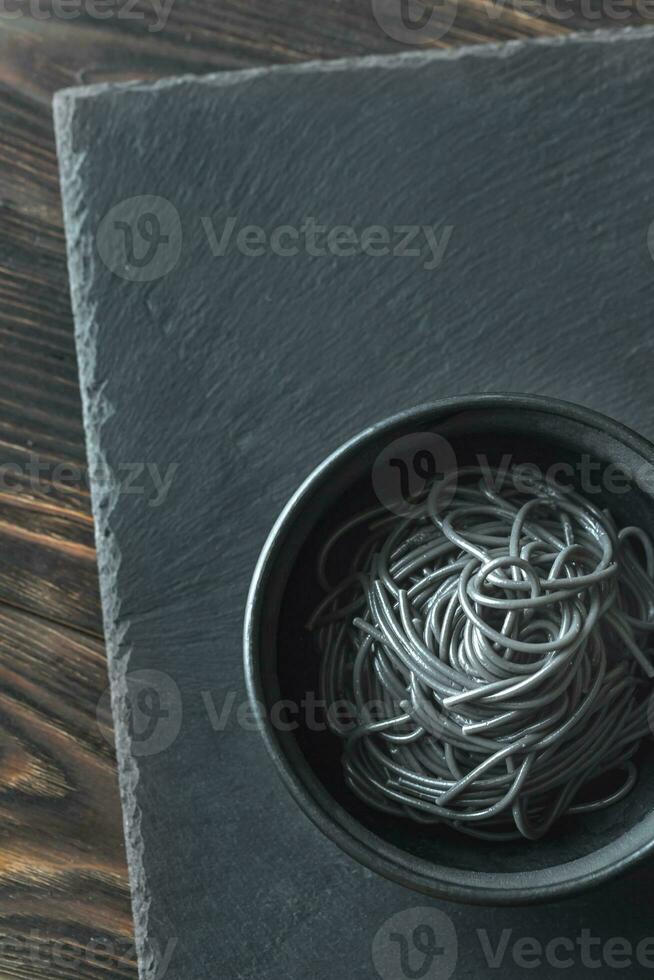 Bowl of pasta with squid ink photo