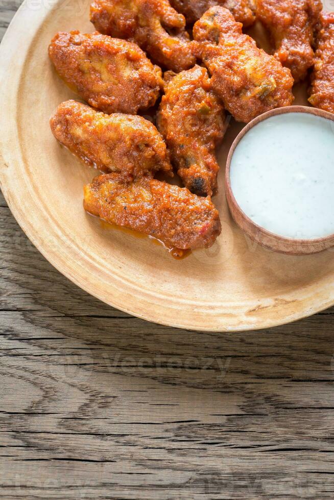 Fried chicken wings with blue cheese sauce photo