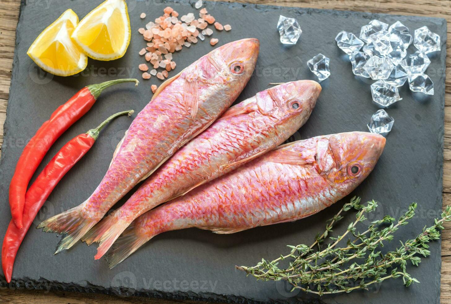 Raw red mullet with ingredients photo