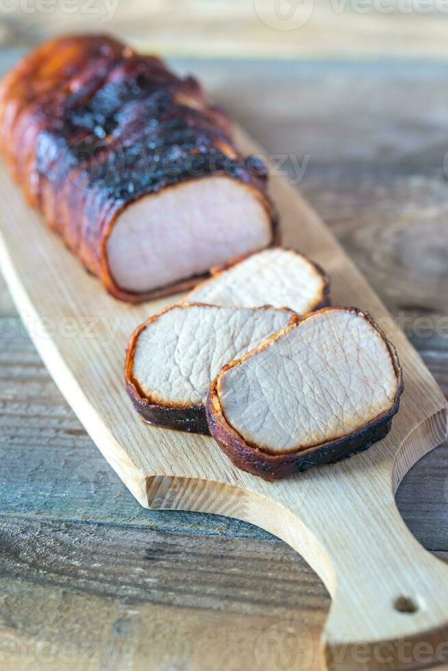 Pork loin wrapped in bacon photo