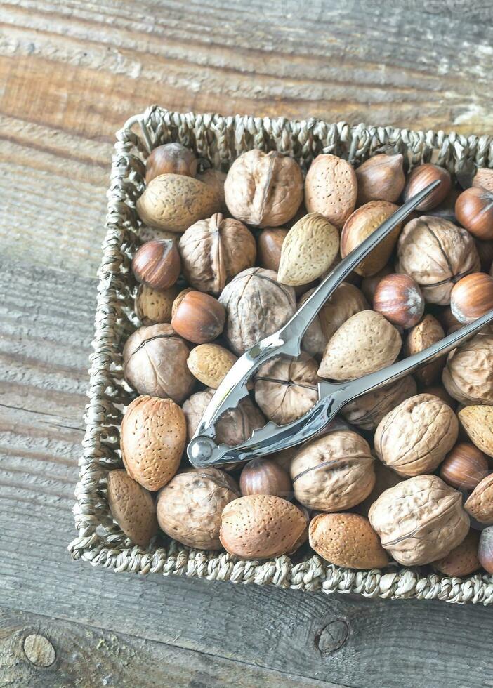 Assortment of nuts in the basket photo