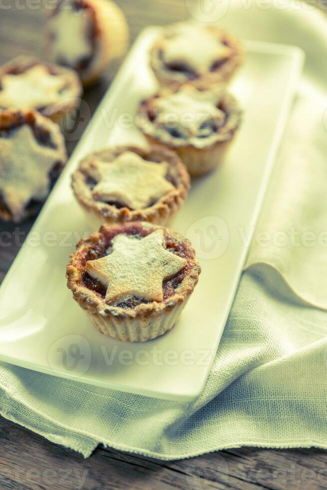 Mince pies with Christmas tree branch photo