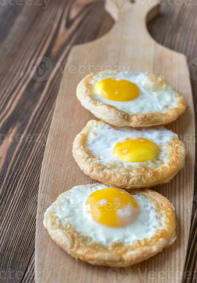 Baked eggs in puff pastry 25234009 Stock Photo at Vecteezy