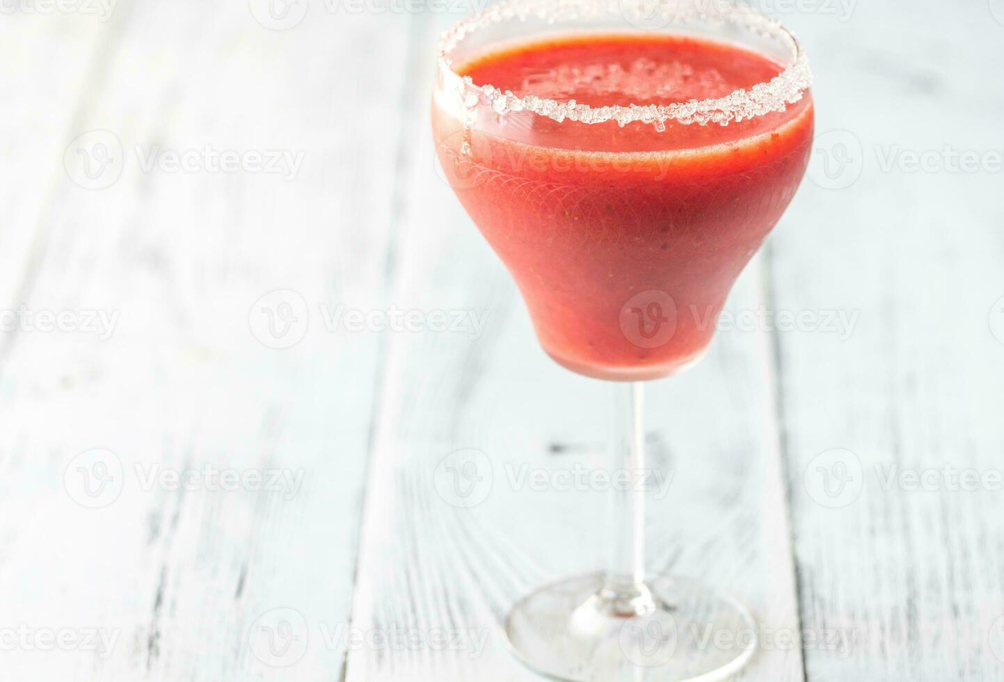 Glass of strawberry margarita cocktail photo