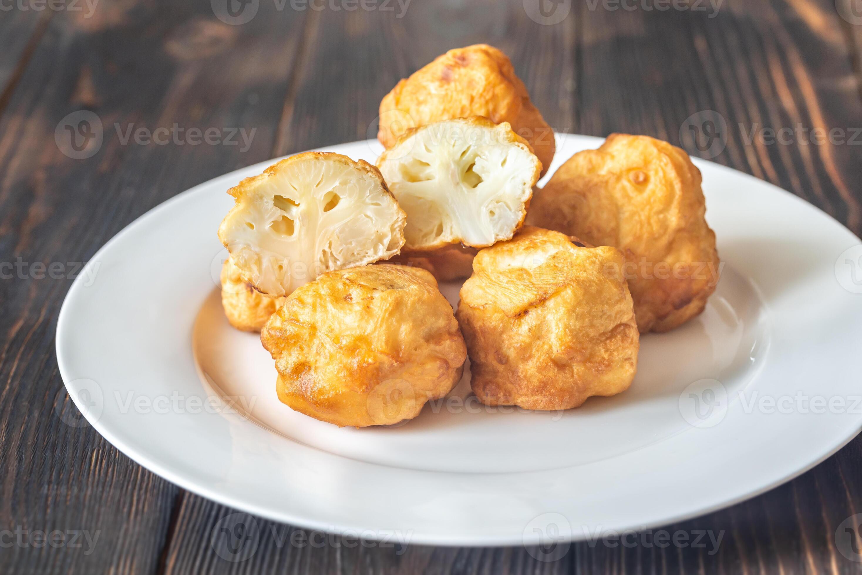 Fried cauliflower coated in batter 25234317 Stock Photo at Vecteezy