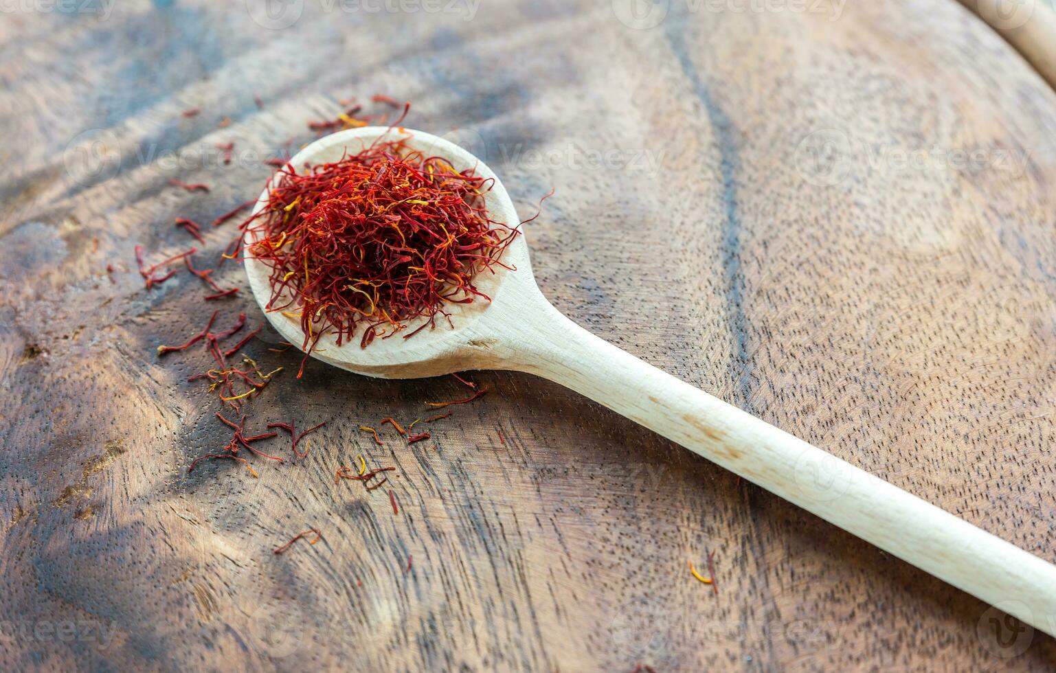 Saffron on the wooden spoon photo