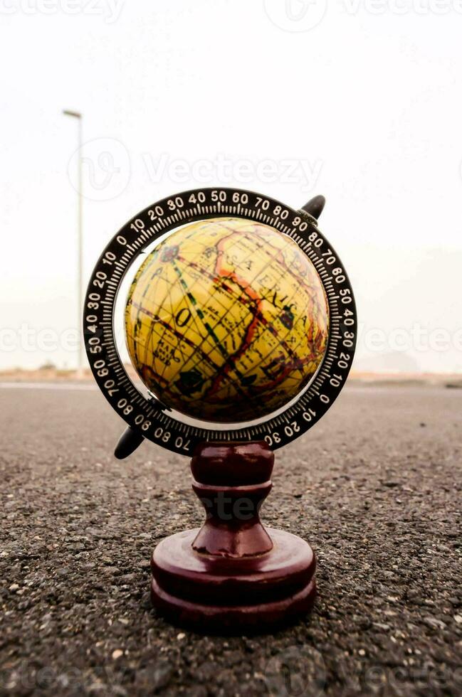 Globe on the road photo