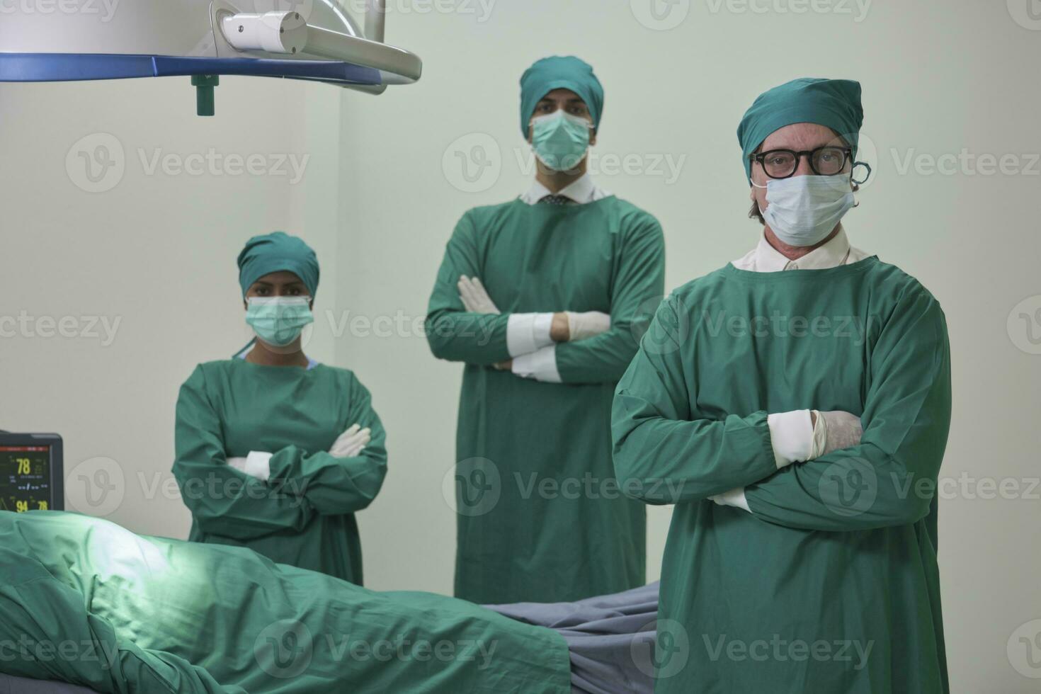 Professional doctors team, specialist surgeons in uniforms, White professors, and assistants wear operating face masks, surgery on critically ill patients in hospital's ICU, and paramedic occupation. photo