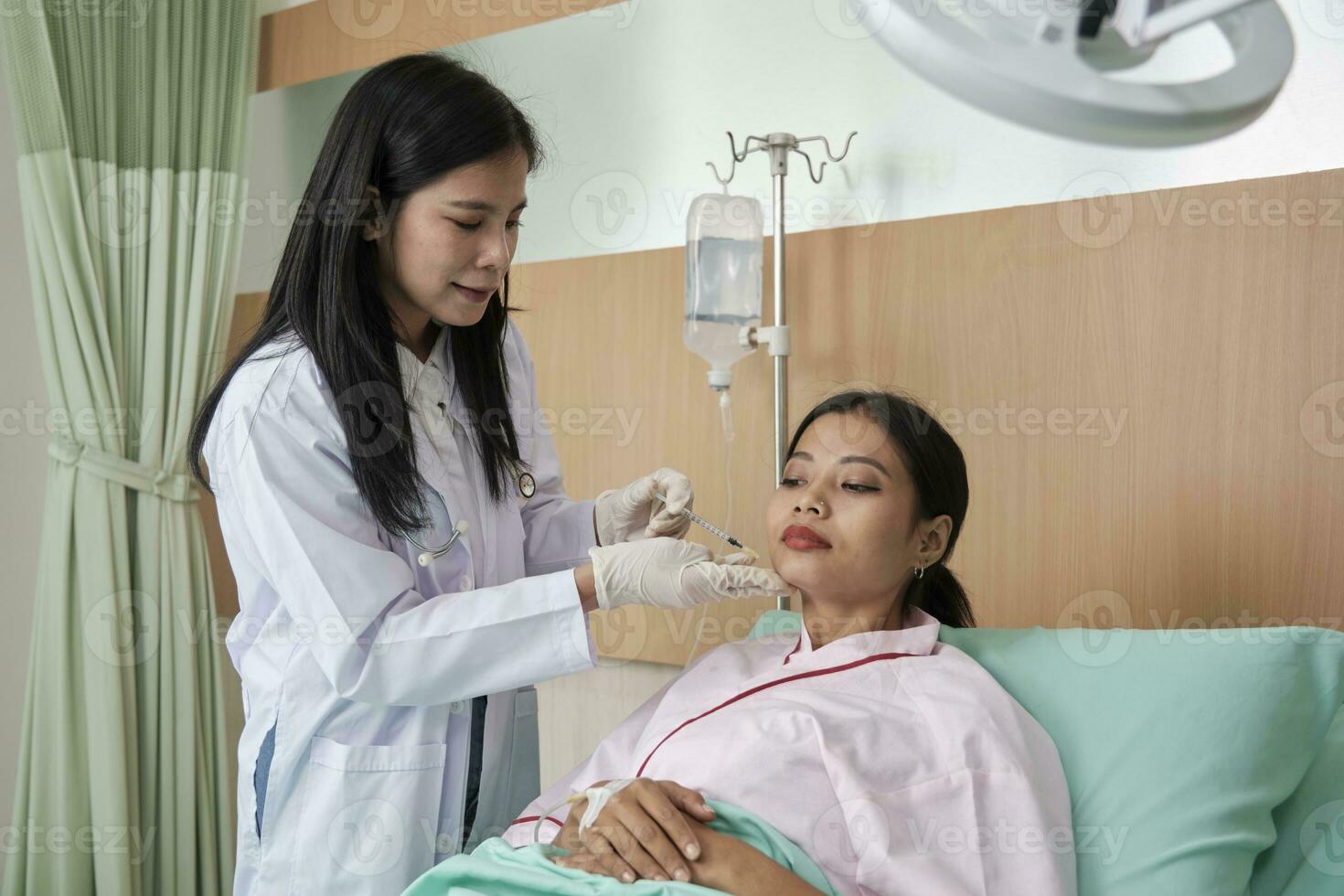 Asian female cosmetic doctor inject Botox into face of woman patient, face care, skin treatment, and young aging with body skincare at beauty clinic hospital, and cosmology medical. photo