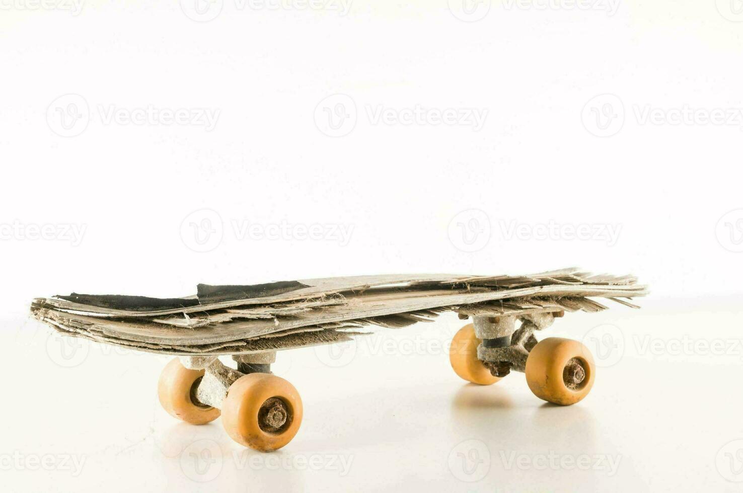 Isolated old skateboard photo