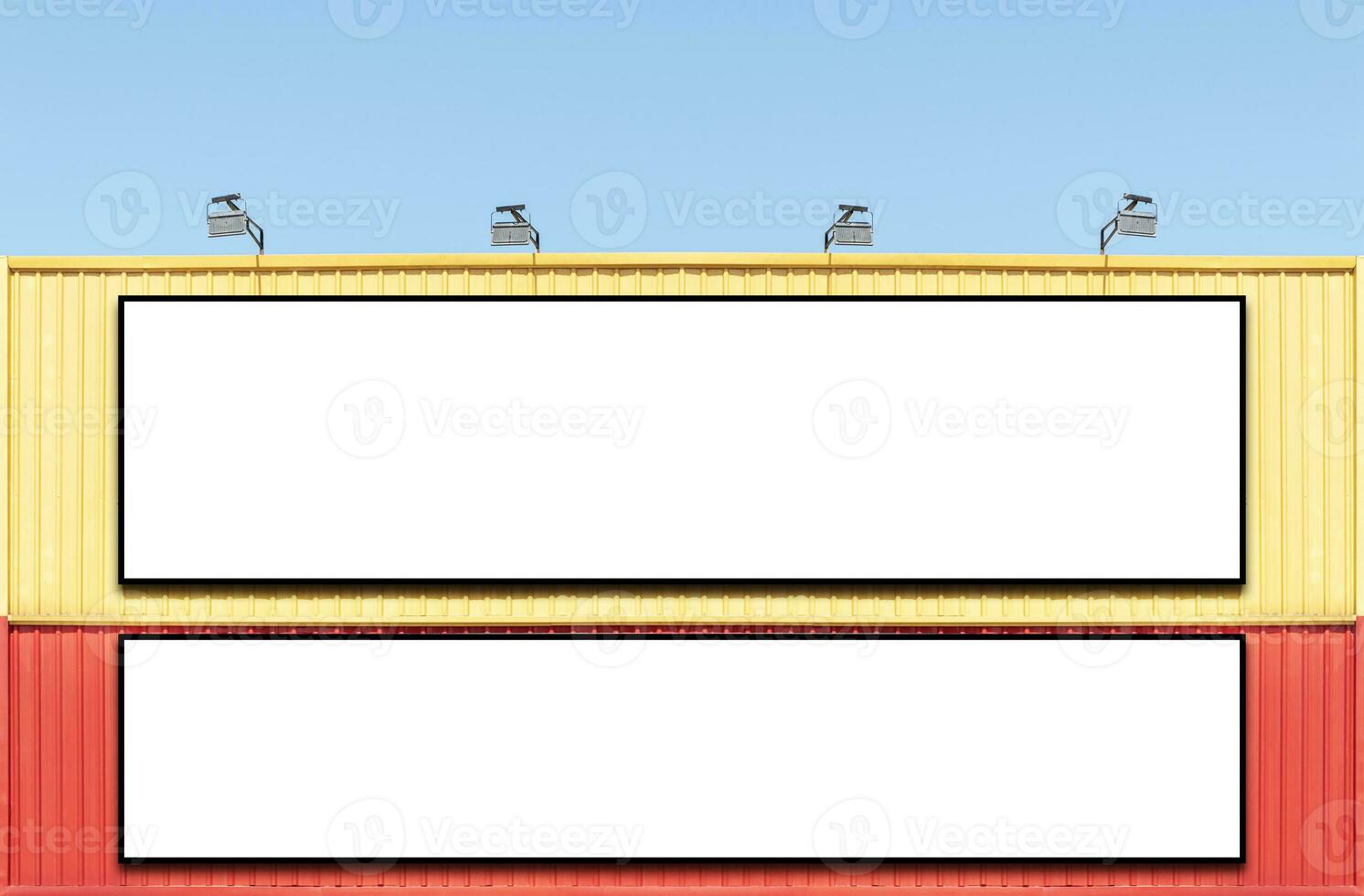 Two billboard white background  on yellow and red building with spot light photo