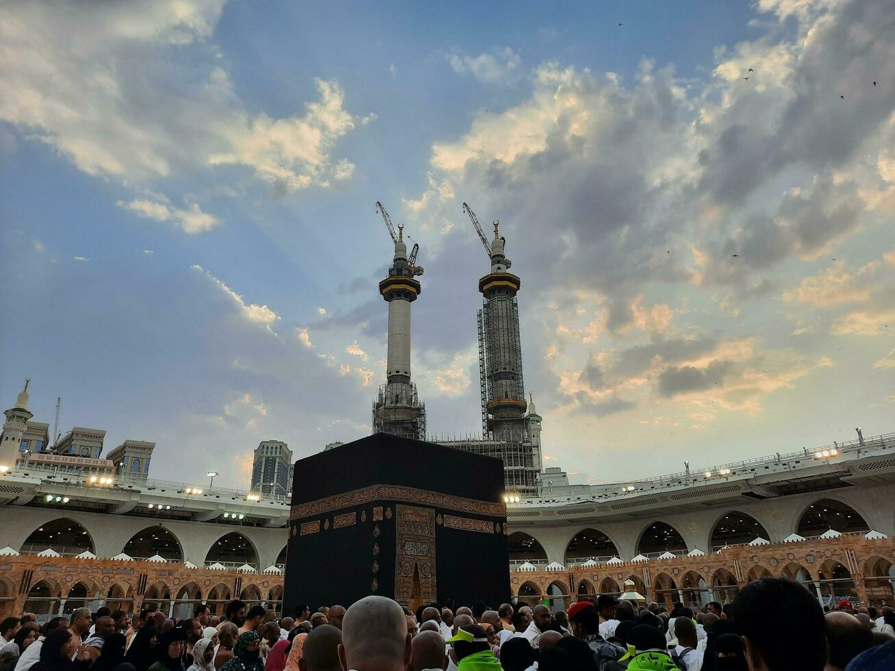 Mecca, Saudi Arabia, June 2023 - Pilgrims from different countries around the world perform Tawaf in the courtyard of Masjid Al Haram, Mecca in the evening. photo