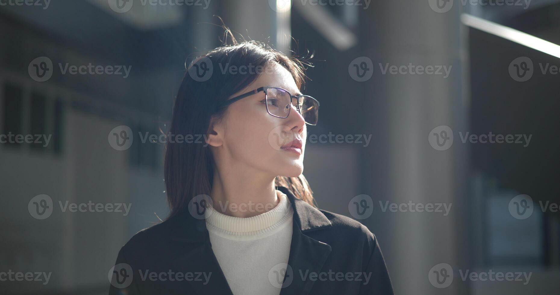 Portrait of Young woman dressed in formal business standing in workplace. photo