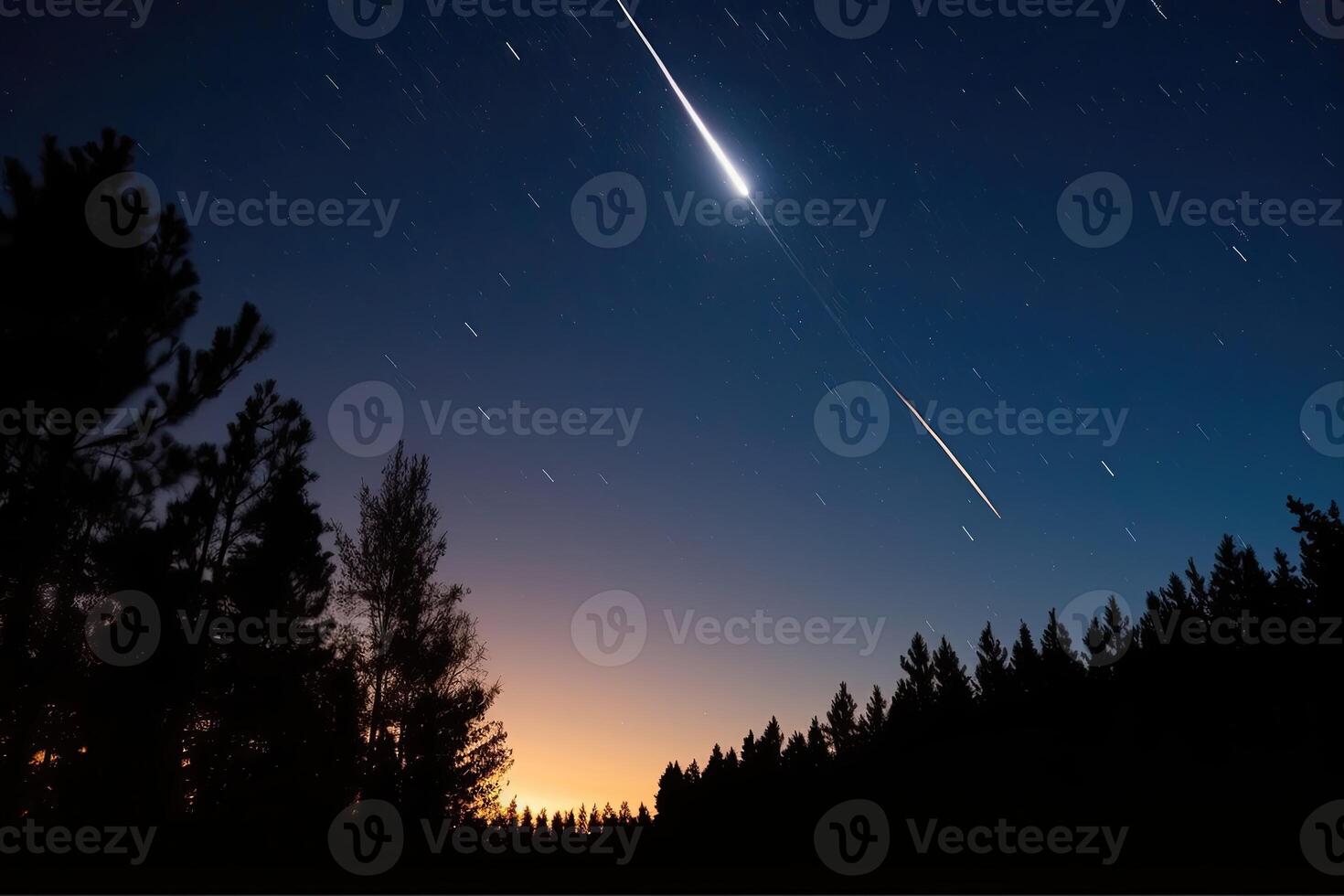 Shooting star streaks across the sky, leaving a trail of light in its wake. photo