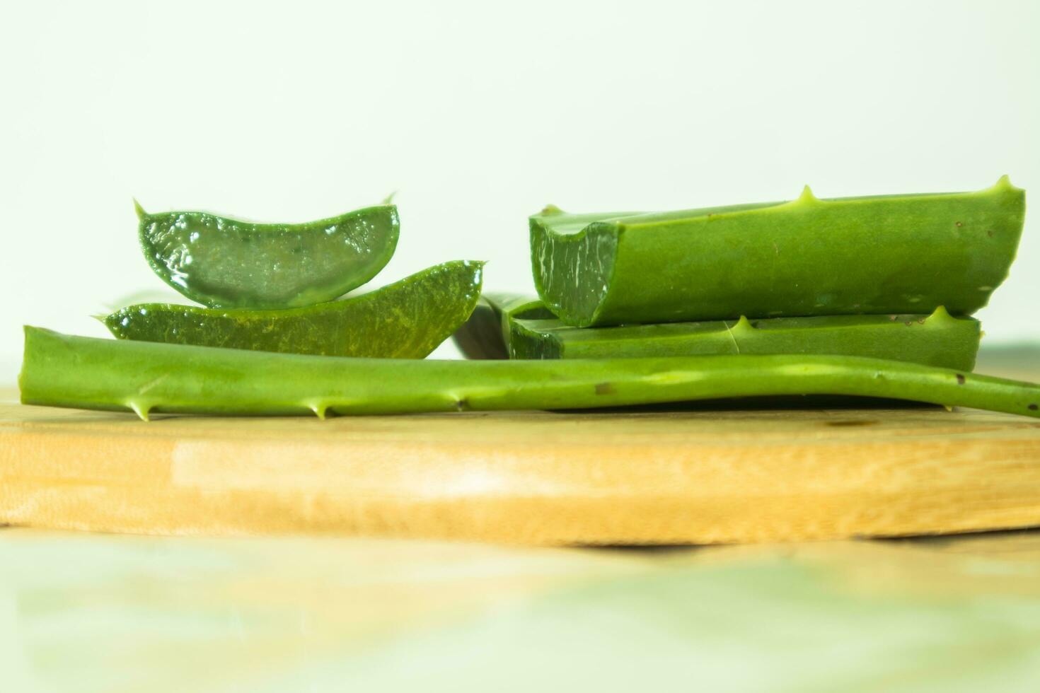 aloe vera on the wooden plate, closeup of photograph photo