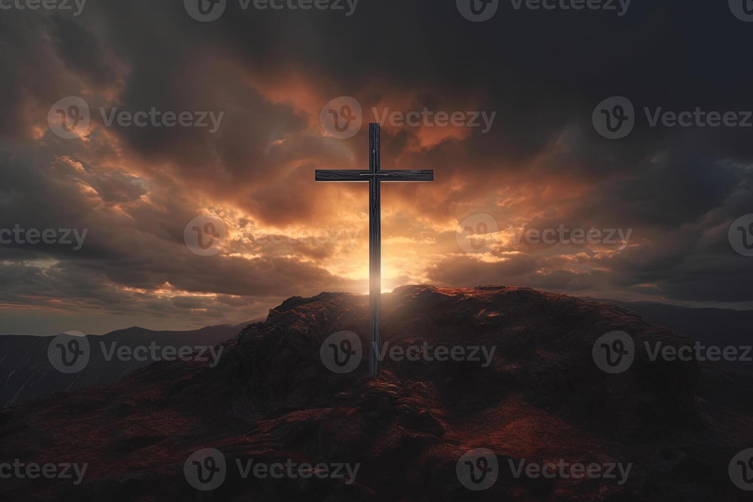 Cross on the top of the mountain with sunset background. photo