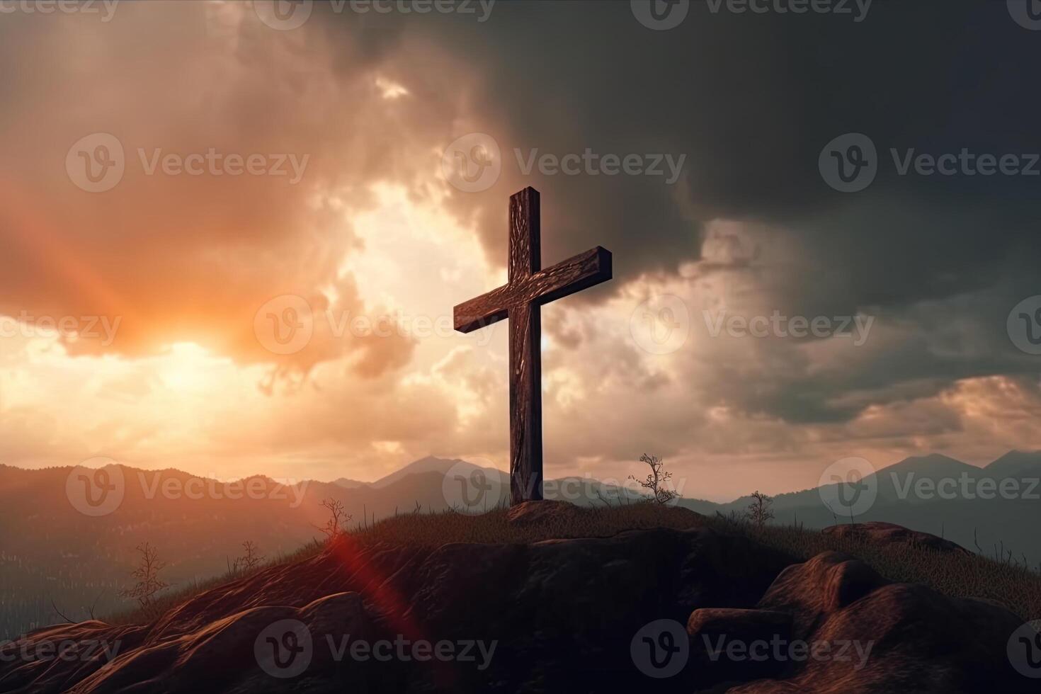 Cross on the top of the mountain with sunset background. photo