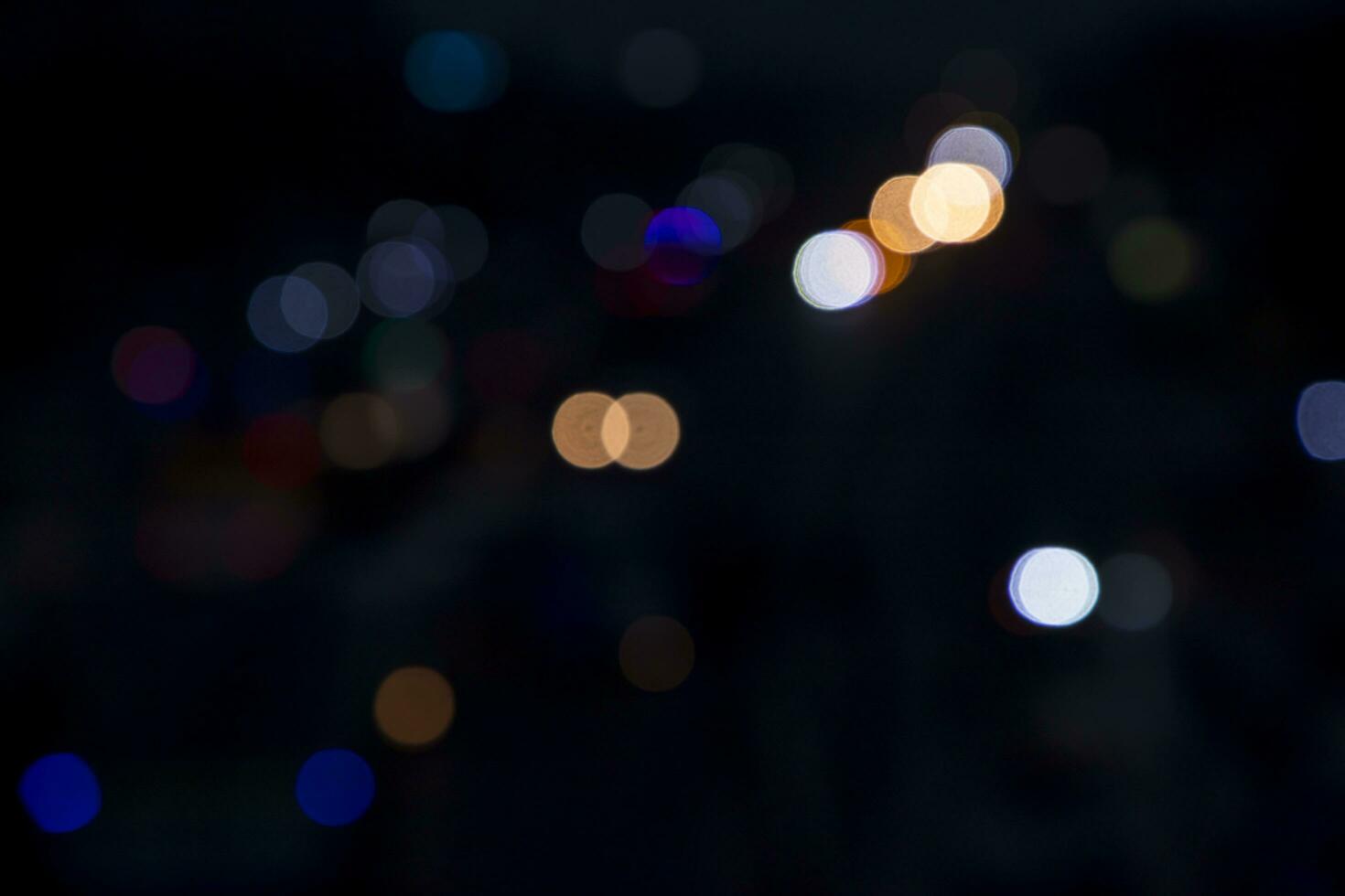 Colorful Defocus Abstract bokeh street lights effects on the night black background texture photo