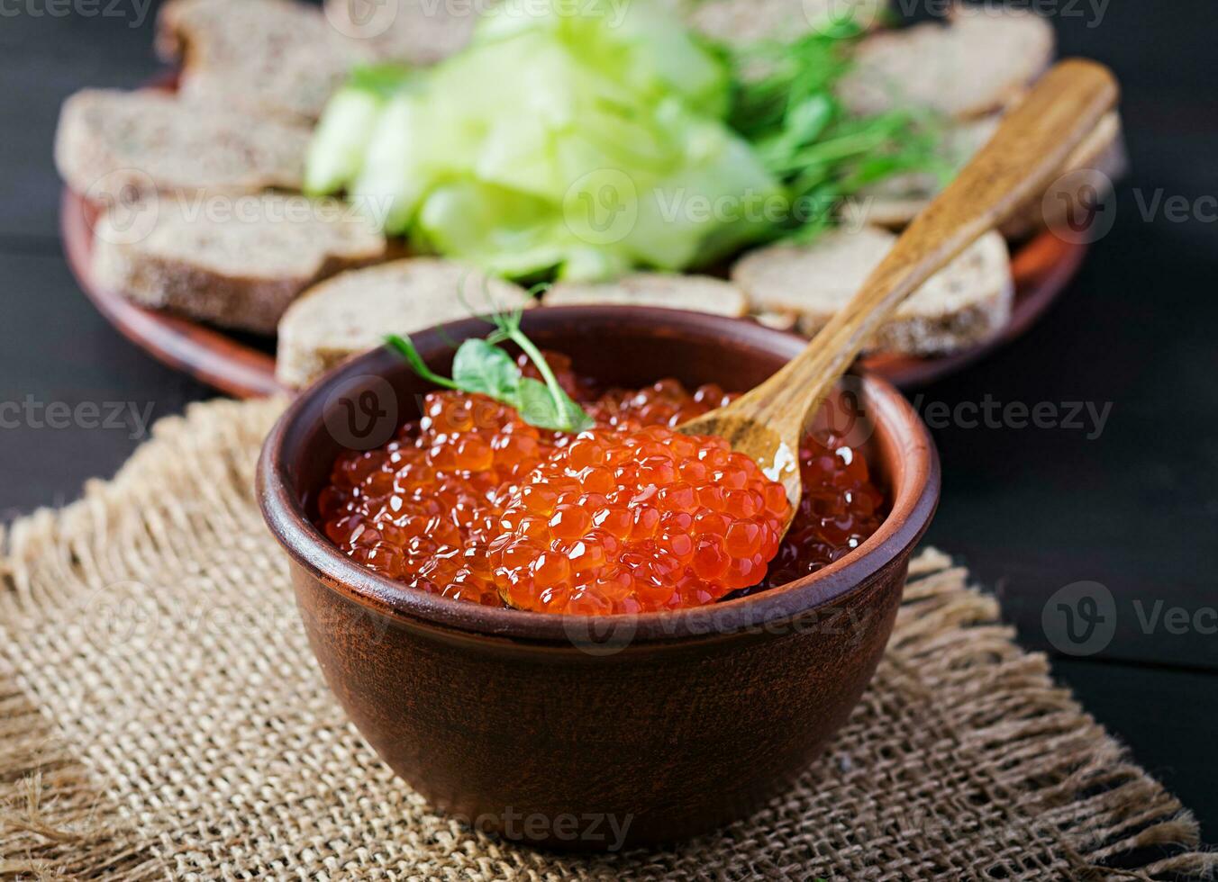 Salmon red caviar in bowl. Delicious food. photo