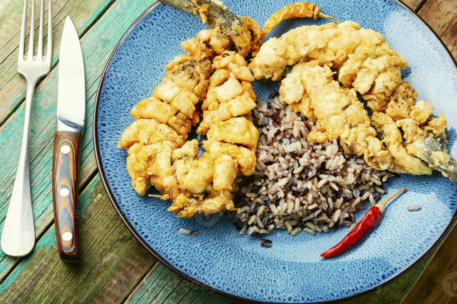 Breaded fish and boiled rice photo