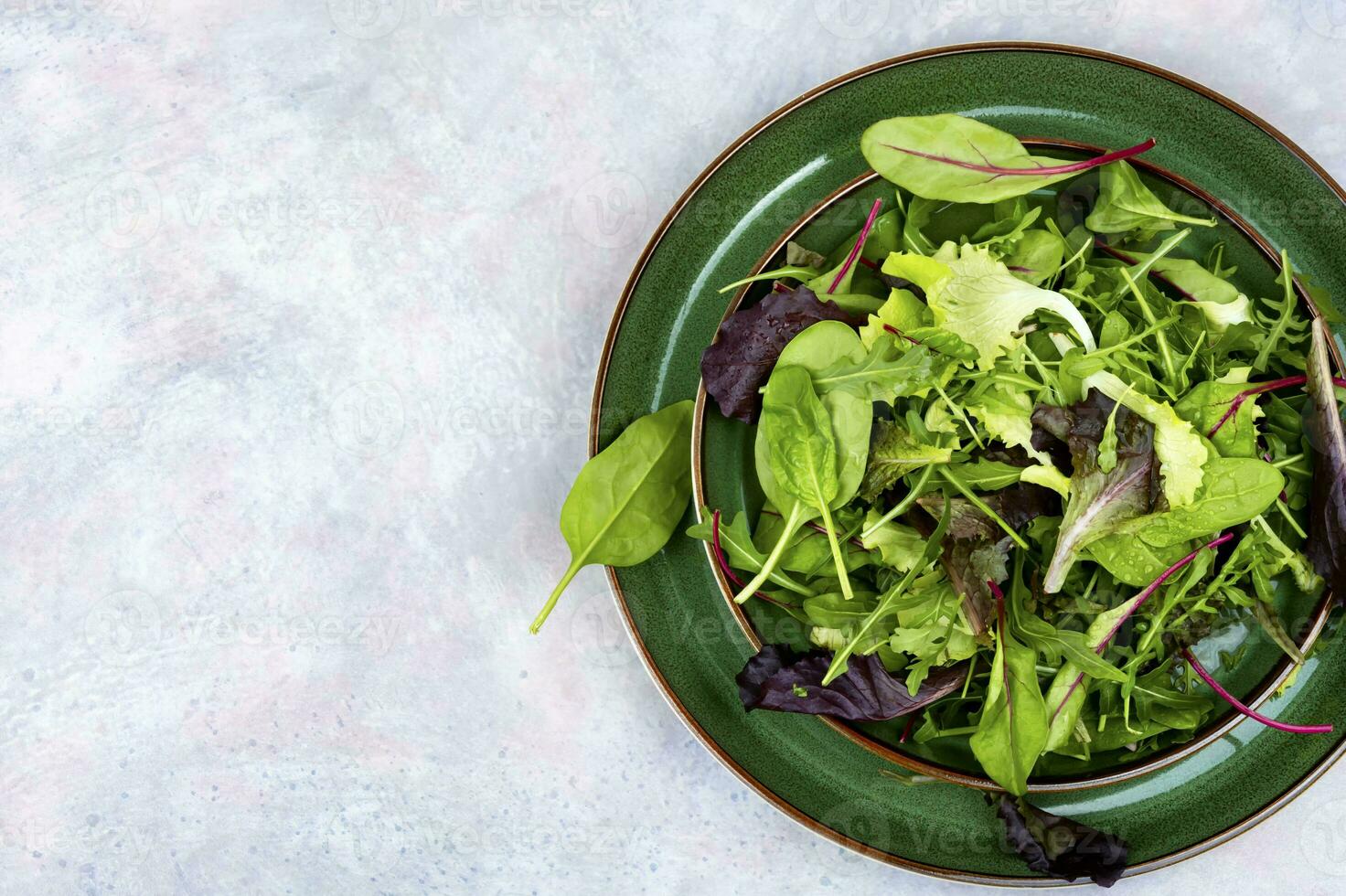 Greens raw salad, healthy eating. photo