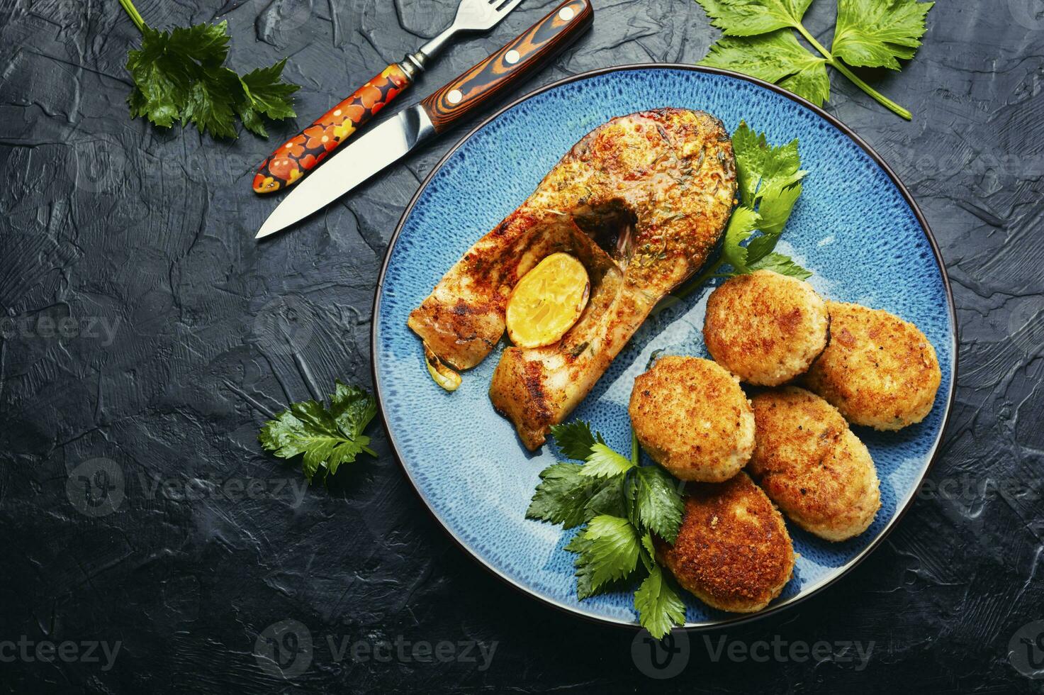 Fried silver carp and fish cutlets photo