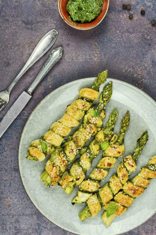 Asparagus baked in bread. photo