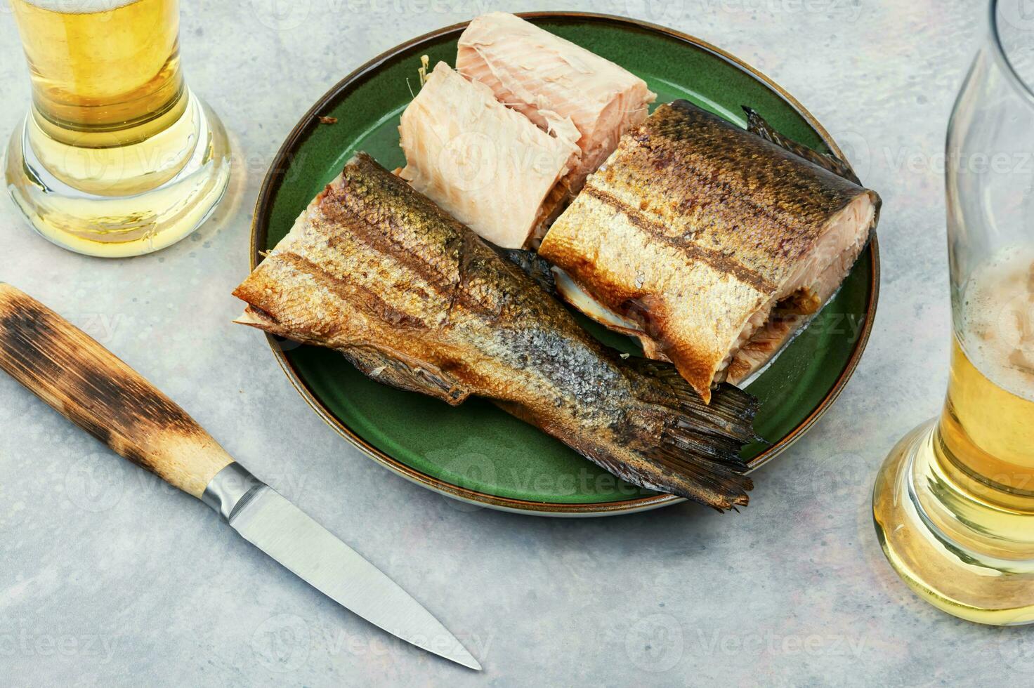 Smoked trout salmon and beer. photo