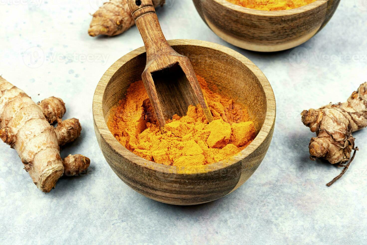Turmeric root and condiment turmeric powder, medicine herb. photo