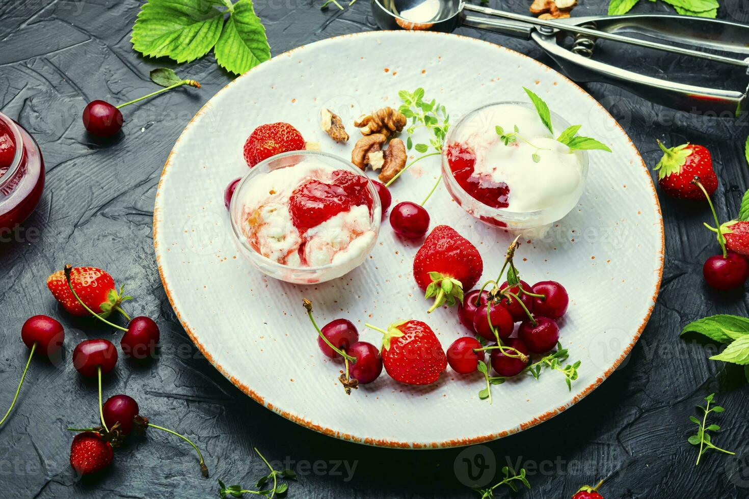 Tasty ice cream with berries and jam photo