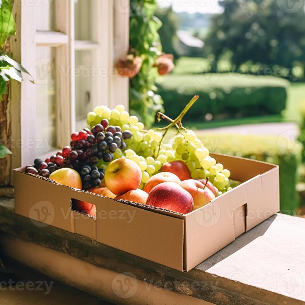Food delivery, postal service and online grocery shopping, fruit box with fresh organic fruits from a local farm on a house doorstep in the countryside, photo