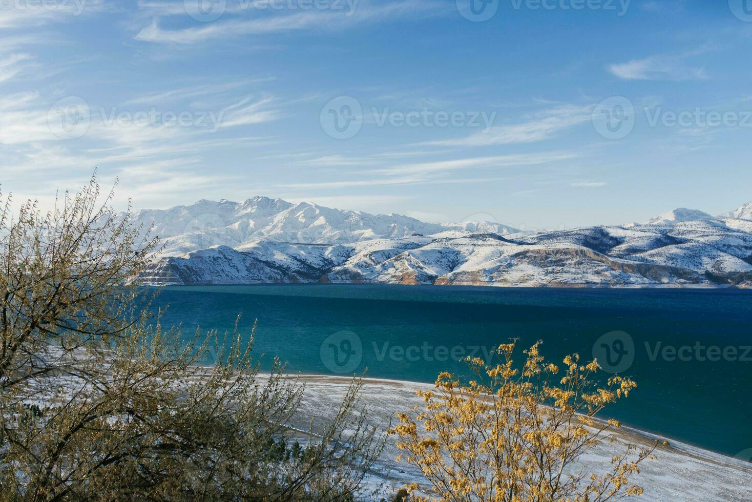 Charvak reservoir near Tashkent in the mountains in winter photo