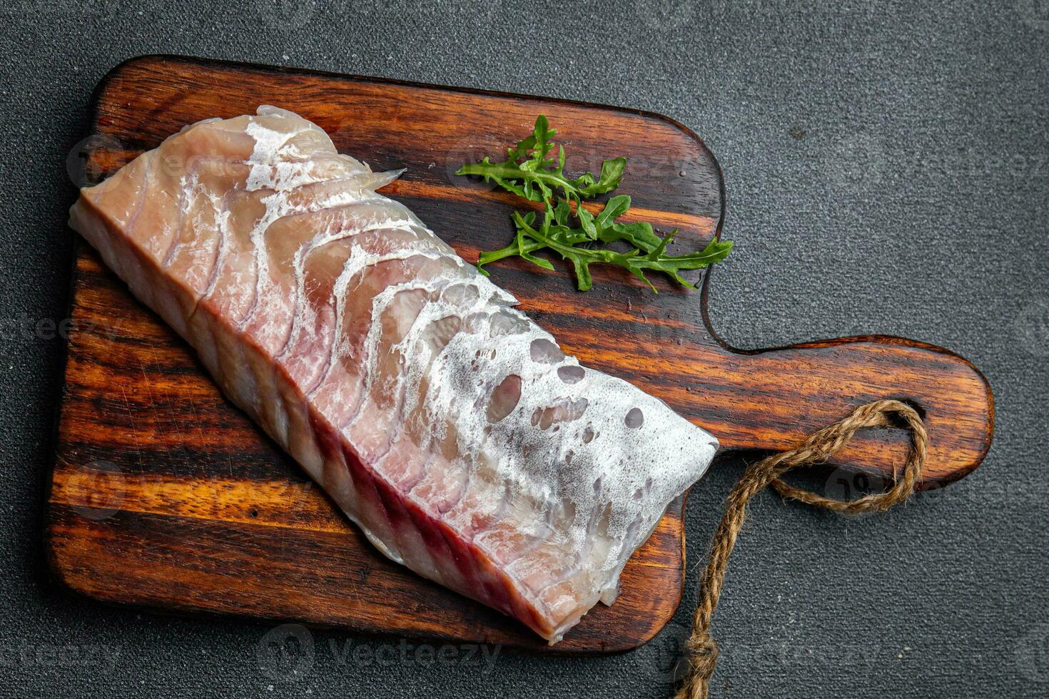 fillet of white fish without skin and bones fresh seafood healthy meal food snack on the table copy space food background rustic top view pescatarian diet photo