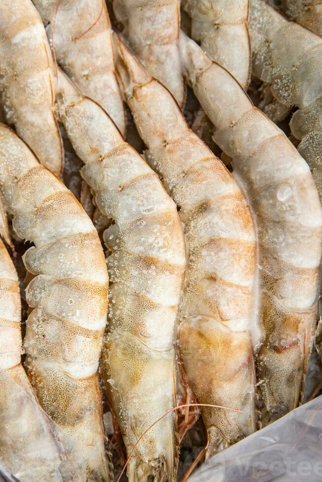 frozen shrimp raw gambas seafood prawn meal food snack on the table copy space food background rustic top view photo