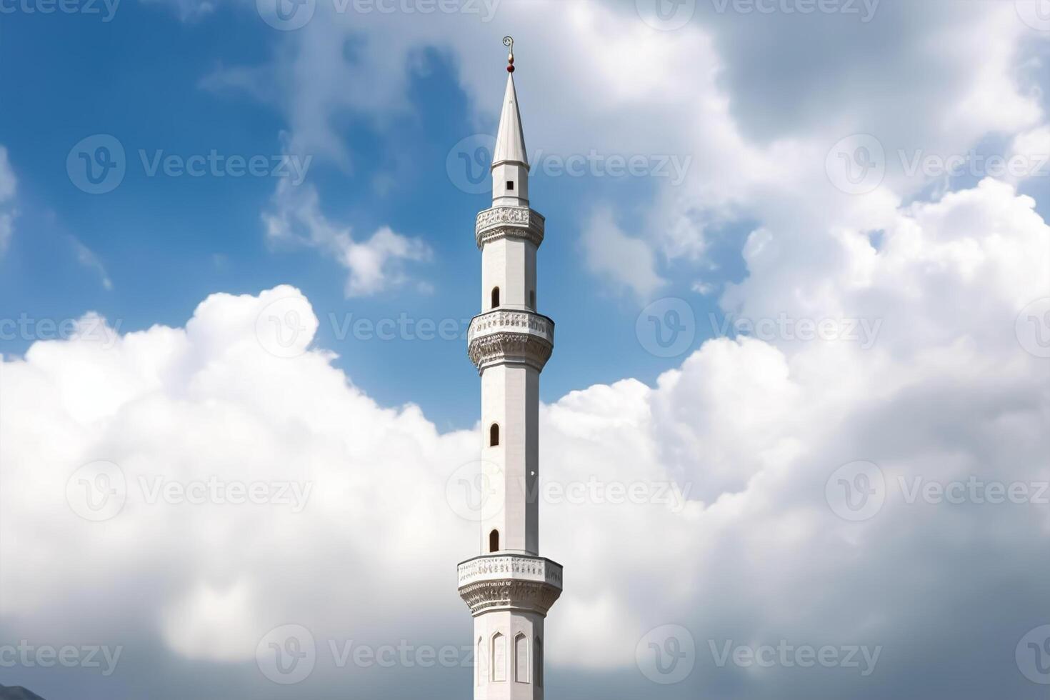 White mosque minaret. Mosque minaret with cloudy sky in background. photo